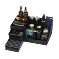 Countertop perfume organizer tray holding fragrance bottles on a vanity.