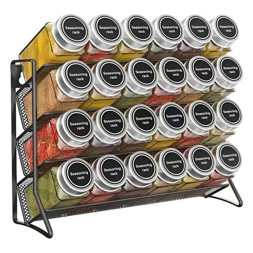 Four tier carbon steel spice rack organizer holding labeled jars on a kitchen wall.