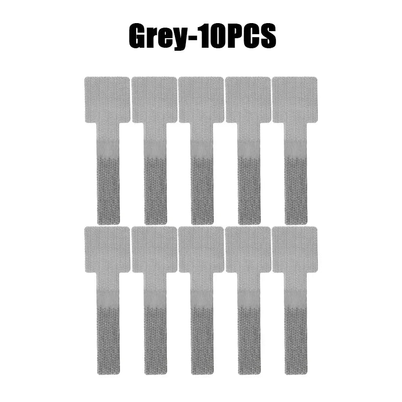 Reusable velcro cable ties bundling several cords neatly on a desk.
