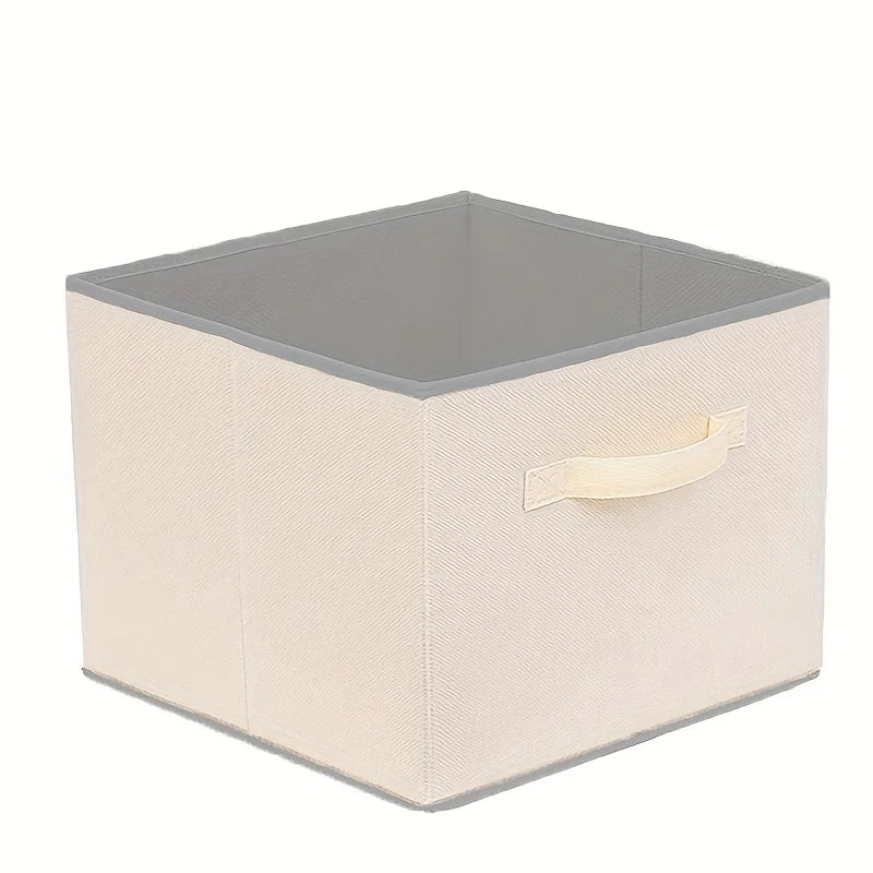Beige multi-layer hanging closet storage bag holding folded clothes on a closet rod.