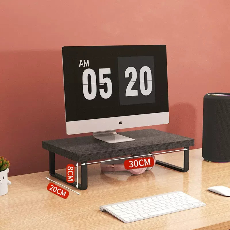 Monitor stand riser lifting a screen with storage drawers underneath on a desk.