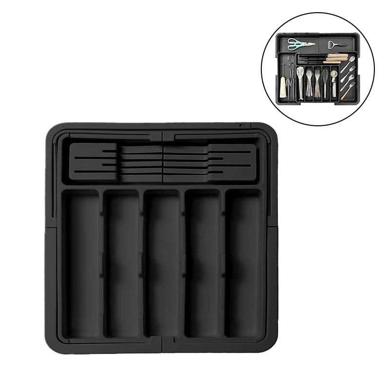 Expandable cutlery tray drawer organizer separating silverware inside a kitchen drawer.