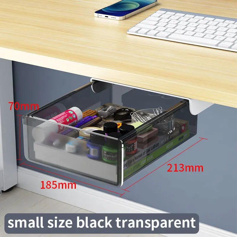 Self-adhesive under desk drawer organizer mounted beneath a desk holding stationery.