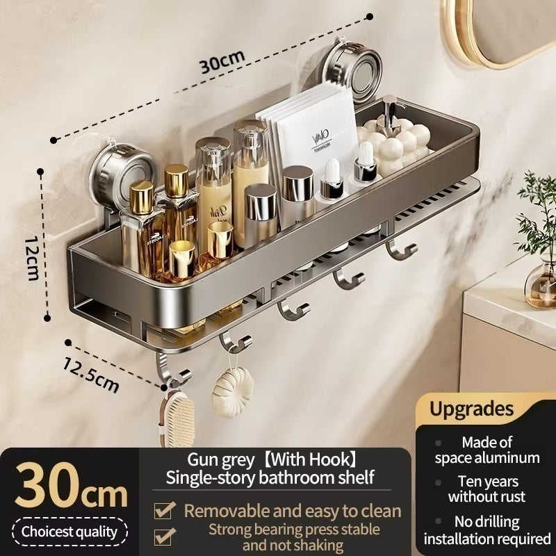 Suction cup shower caddy and towel holder mounted on shower tile holding bottles.