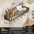 Suction cup shower caddy and towel holder mounted on shower tile holding bottles.
